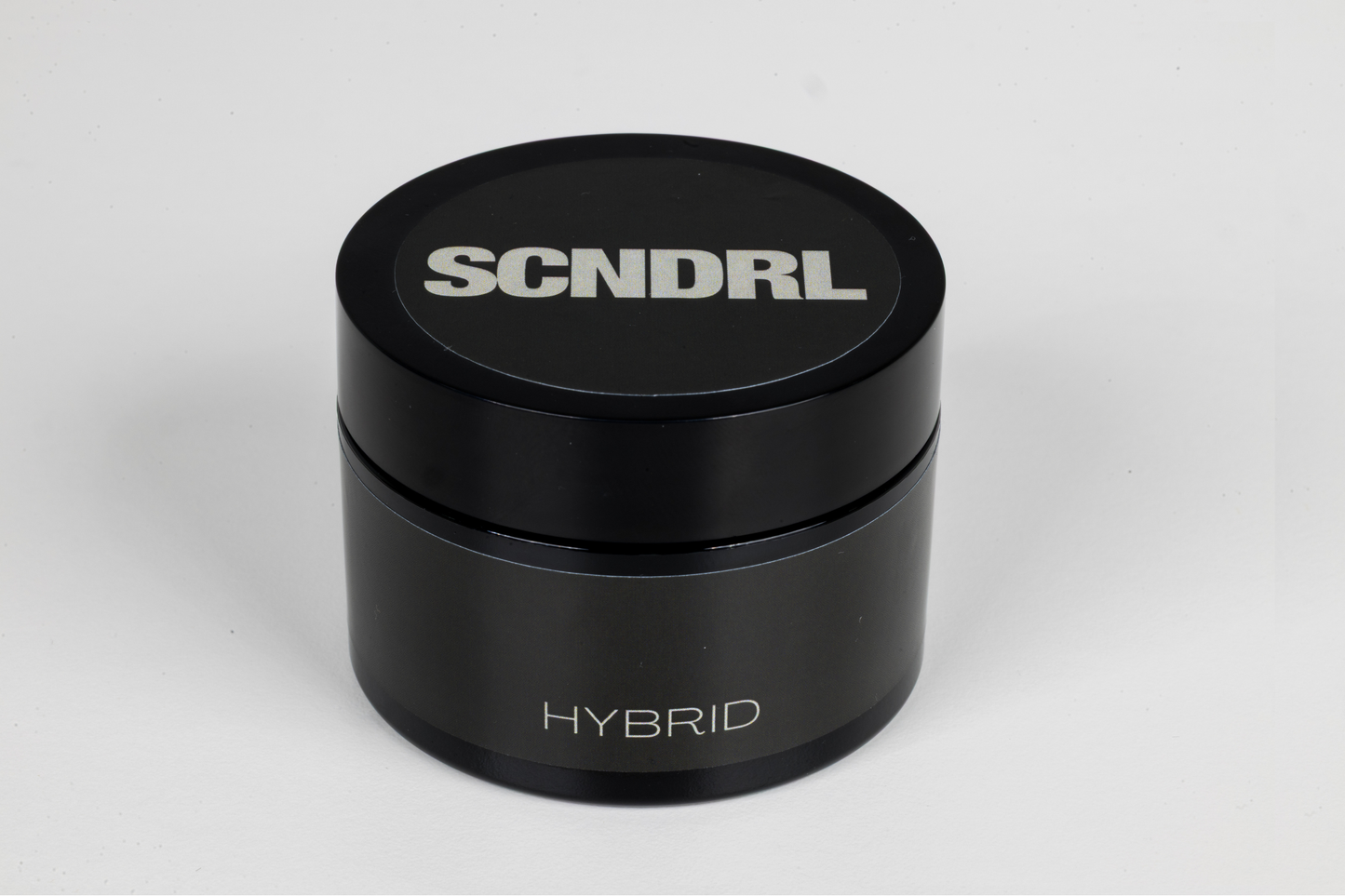 Black container with 'SCNDRL' branding on a white background