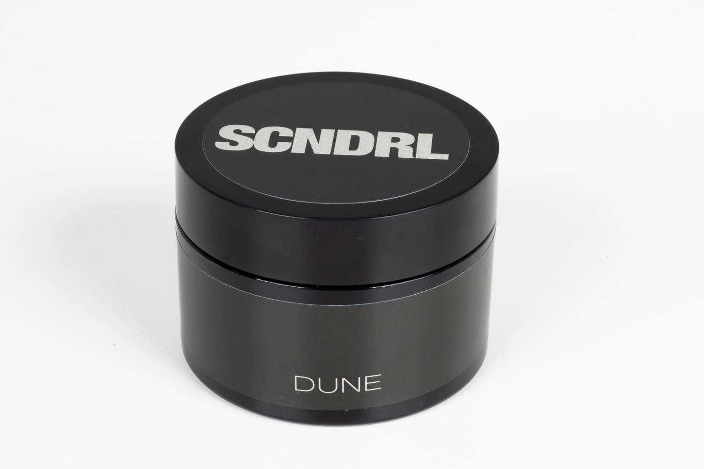 Black container with 'SCNDRL' branding on a white background