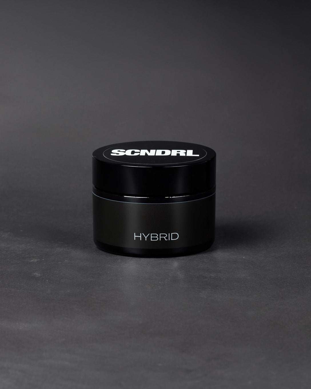 Black container with 'SCNDRL' branding on a gray background