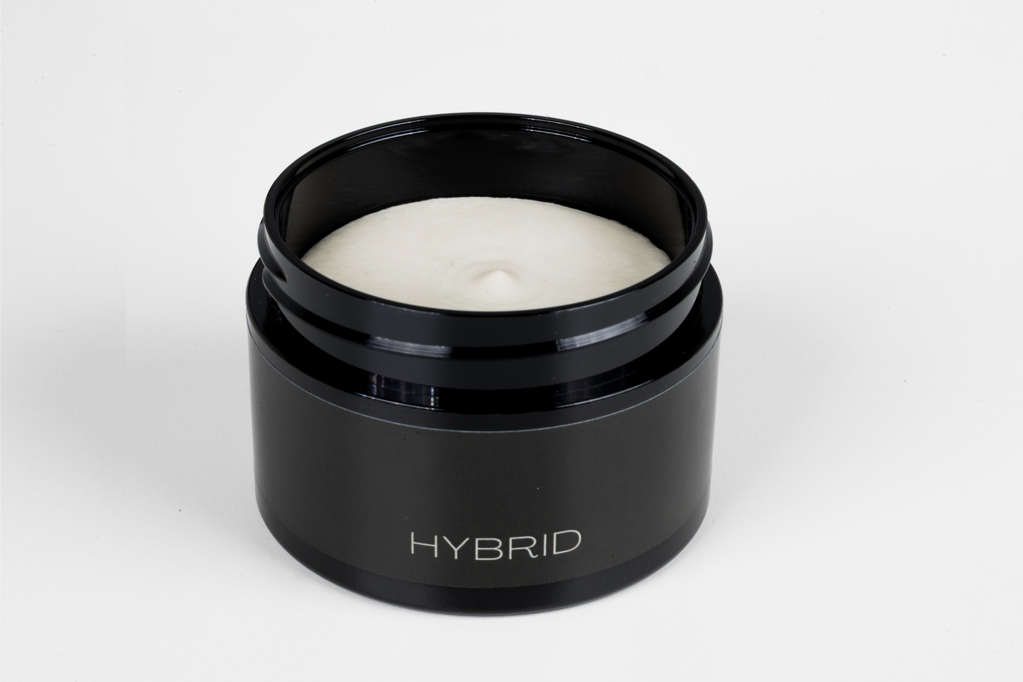 Black container with white substance labeled 'Hybrid' on a white background